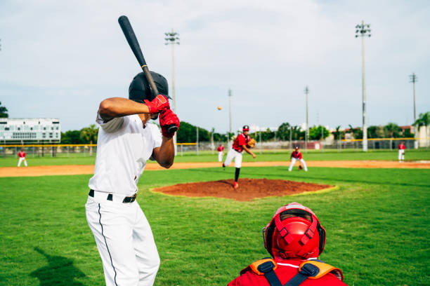 Baseball players on baseball field.
